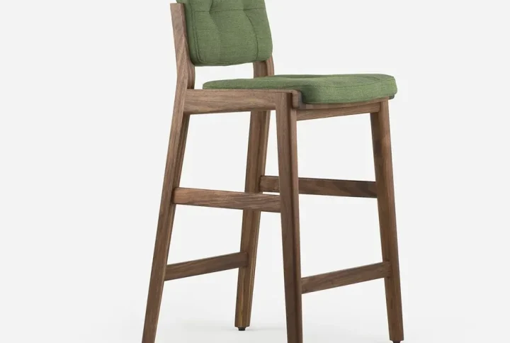 A green bar stool featuring a wooden frame, showcasing a modern design suitable for various interior settings