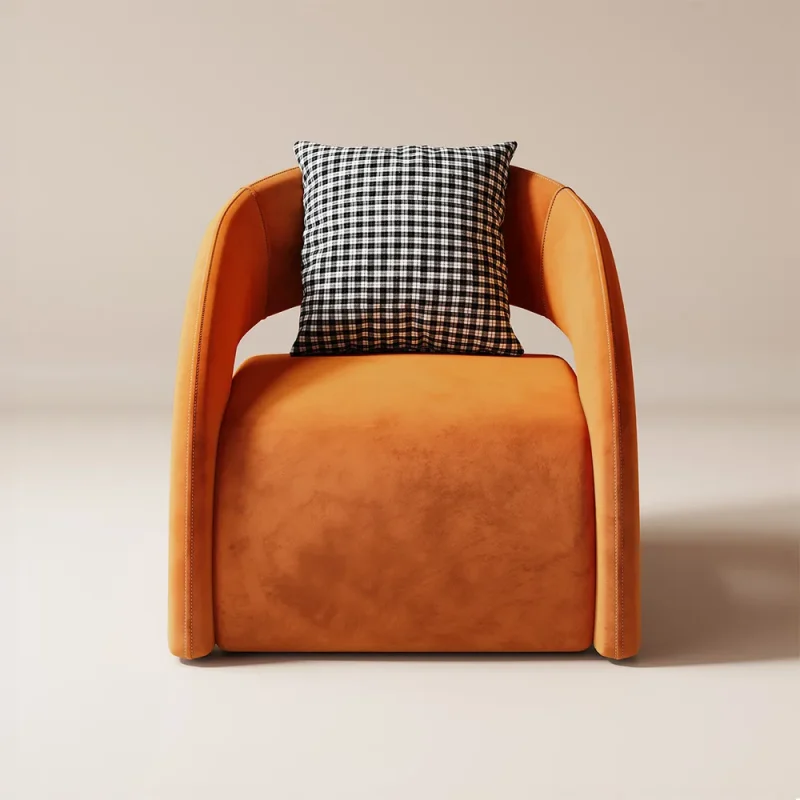 This lounge chair exudes contemporary elegance with its sleek curved armrests and plush velvety upholstery in a warm inviting hue. The minimalist design is complemented