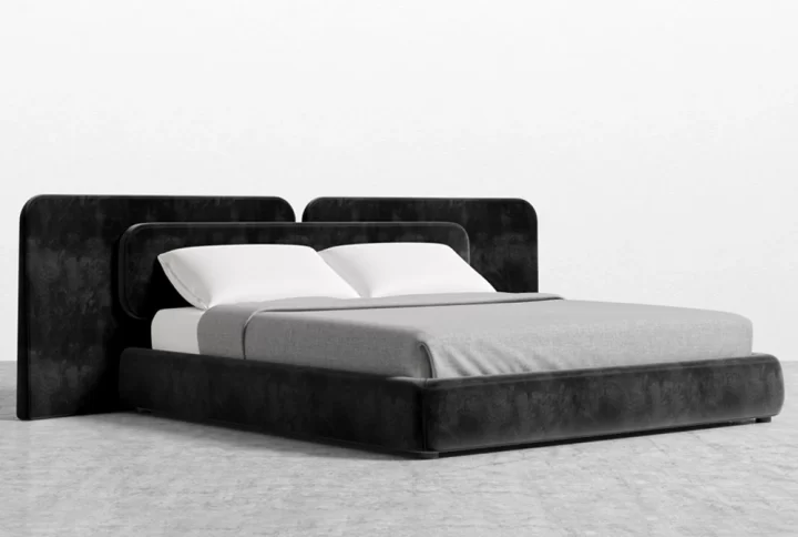 A stylish bed featuring a sleek black headboard and footboard, enhancing the modern aesthetic of the room