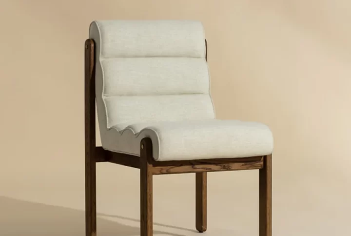 The Estelle Dining Chair is made for gatherings. Upholstered in great linen performance fabric with horizontal tufted channeling for textured comfort and a solid oak wood frame, this dining chair is trendsetting with its minimalism