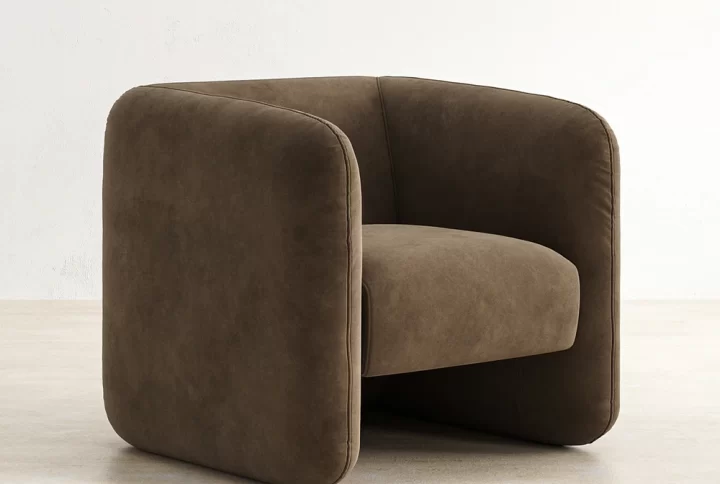 A brown Euro armchair featuring a curved back and arms, designed for comfort and elegance in any setting