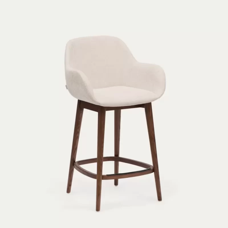 A wooden-framed stool featuring a comfortable upholstered seat, ideal for various settings