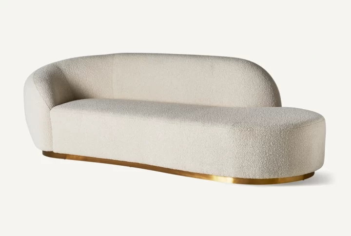 Modern Deco Delight Boucle Sofa featuring elegant gold legs and a luxurious white fabric upholstery