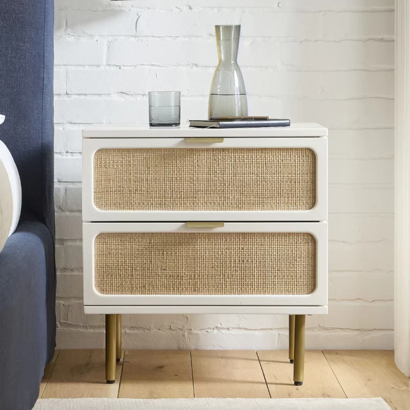 A stylish white and gold nightstand featuring two spacious drawers for storage and organization