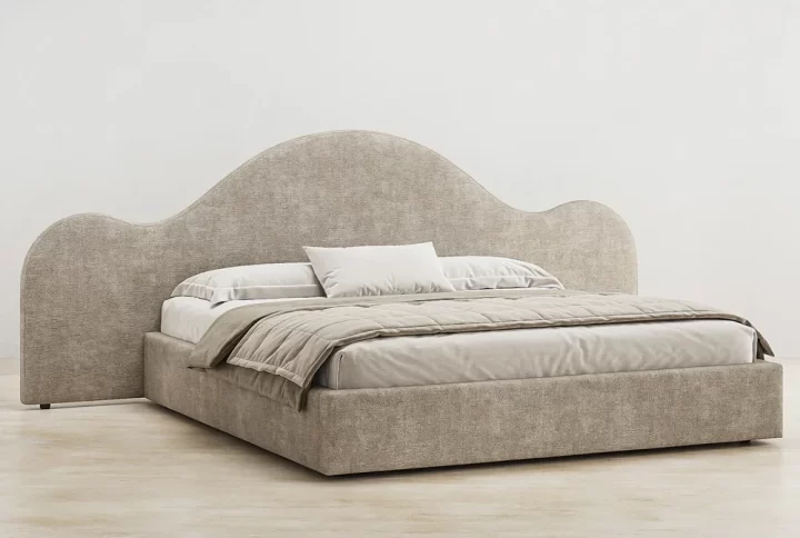 A stylish bed featuring a gracefully curved headboard, enhancing the elegance of the bedroom decor