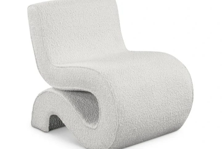 Scandiline Bouclé S-Chair with S-shaped silhouette upholstered in rich bouclé fabric