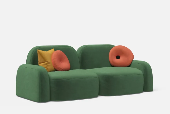 Luna 2 Seater Sofa in green upholstery with rounded silhouette and playful accent pillows
