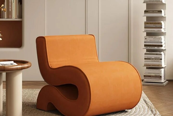 Scandiline S-Chair with iconic S-curve silhouette upholstered in plush velvet styled in modern living room