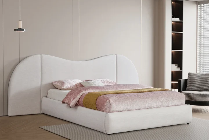 Everest Linen Fabric Bed in cream linen with curved headboard and removable side panels styled in modern bedroom