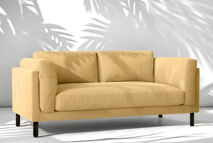 Sven Large 2 Seater Sofa in vibrant yellow fabric with dark wooden legs styled in modern living room