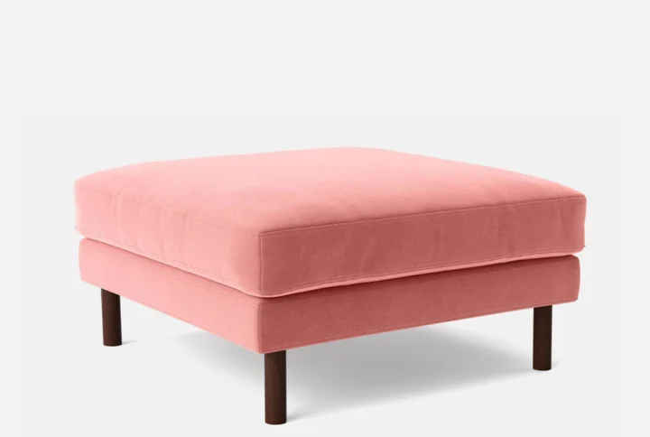 Vellure Ottoman in Salmon Red velvet with wooden base styled in modern living room