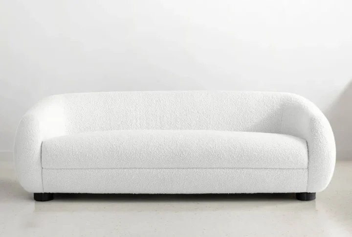 Modern luxury curved white sofa for minimalist living spaces in the UAE