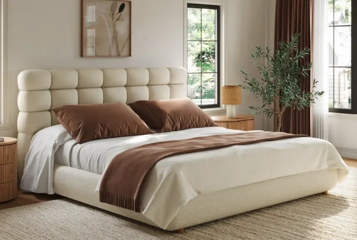 Lunara Bouclé Bed with box-tufted headboard and minimalist wooden legs styled in modern bedroom