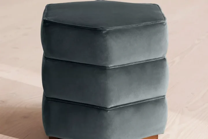 Lia Footstool with hexagonal silhouette and cotton velvet upholstery in modern living room