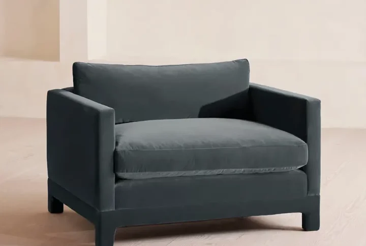 Velveton Loveseat in bespoke velvet with angular arms and deep cushioned seat