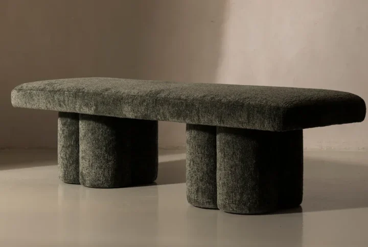 Cosmos Boucle Bench in neutral beige with sculptural cylindrical legs and boucle upholstery