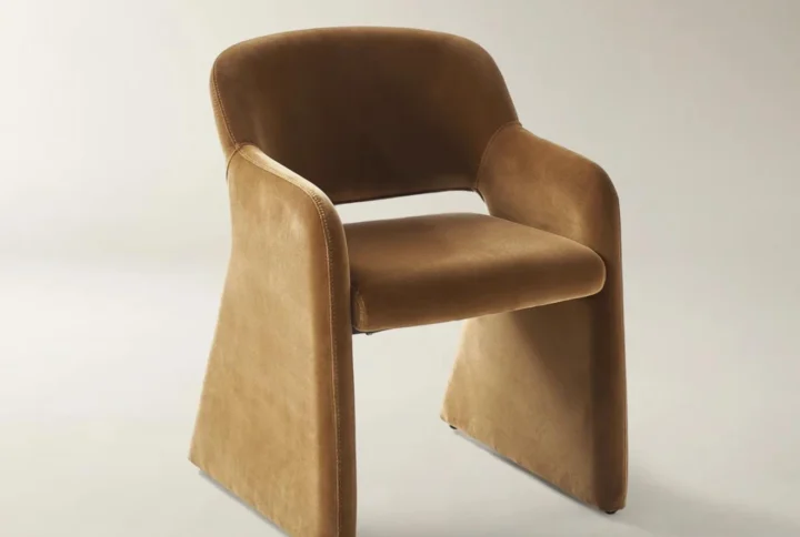 Ellora Dining Armchair in charcoal velvet with curved silhouette and armless ergonomic design