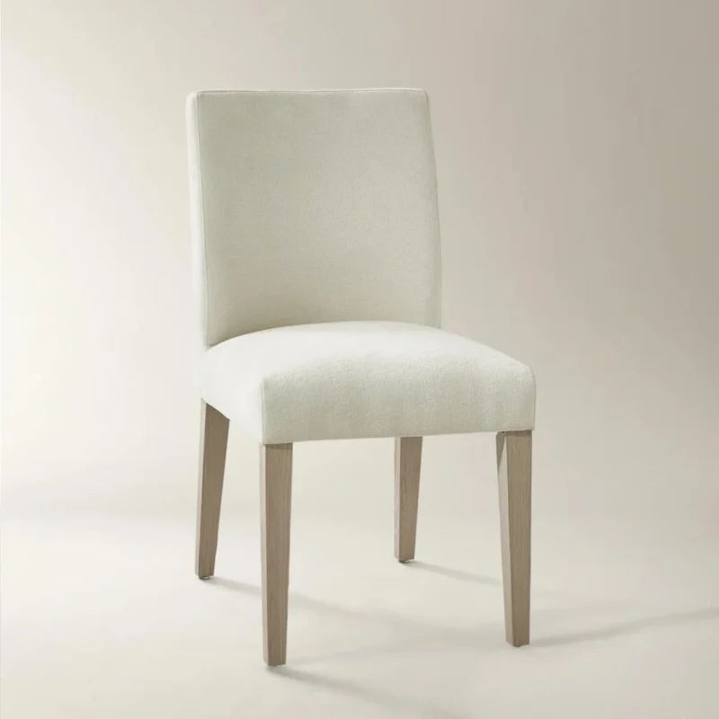 Modern off-white upholstered dining chair with high back and natural wood legs.