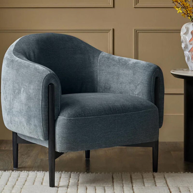 elara accent chair with curved armrests and rounded silhouette