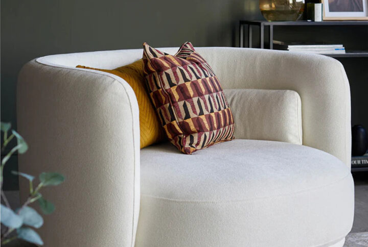 Henry ivory boucle swivel love seat in living room