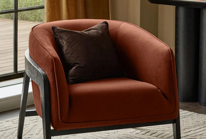 The Palmer Toffee Red Occasional Chair combines bold design wi