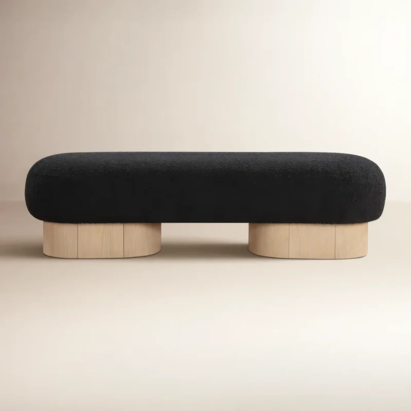 black fabric upholstered bench in soft bouclé with rubberwood legs